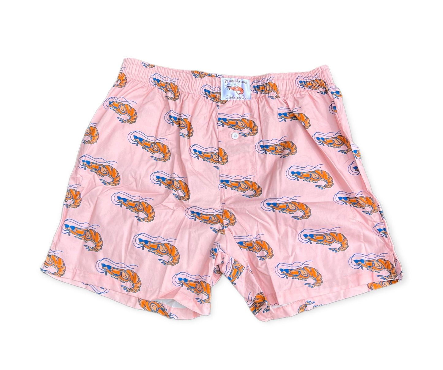 Image of Pimp Shrimp premium 100% woven cotton boxer shorts! Super comfortable, cool, and great looking! Our elastic waistband is a bit wider for comfort, and long lasting. The button fly has a clean look along with the v-groove and 4" inseam. MUCH thought went into making a traditional looking boxer, while offering something fresh, versatile, great looking and in keeping with the Pimp Shrimp brand. Light Pink boxers with the pimp shrimp logo. 